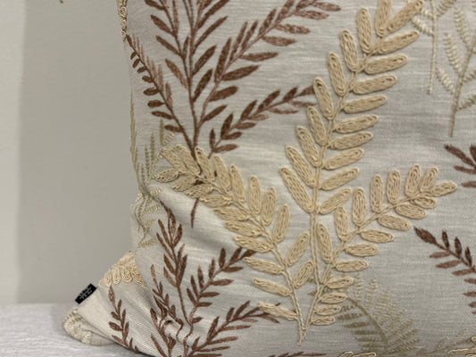 Close-up of Willow Fern Cushion showing raised fern embroidery