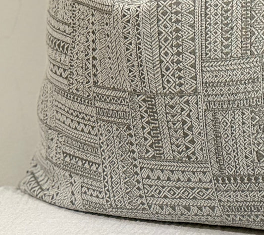 Close-up of Nomad Dune Cushion showing taupe and greige embroidered geometric fabric | Interiors by Kai