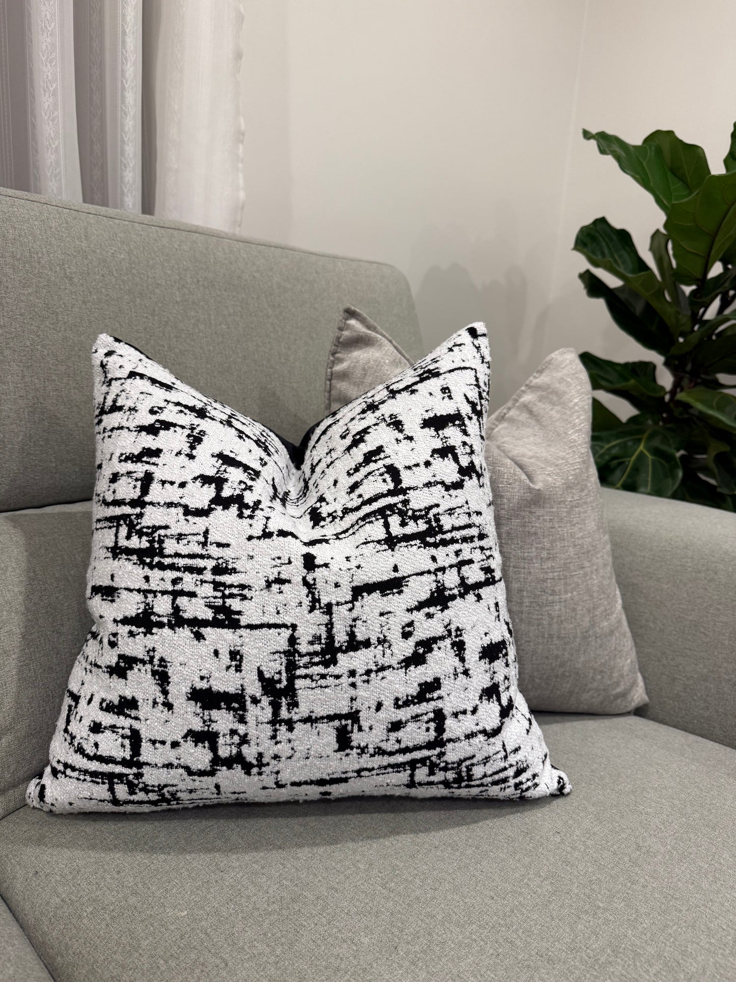 monochrome muse cushion with gray cushion| interiorsbyzai