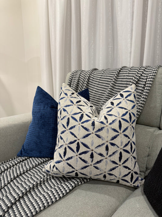 Midnight Tides cushions styled on a grey sofa.