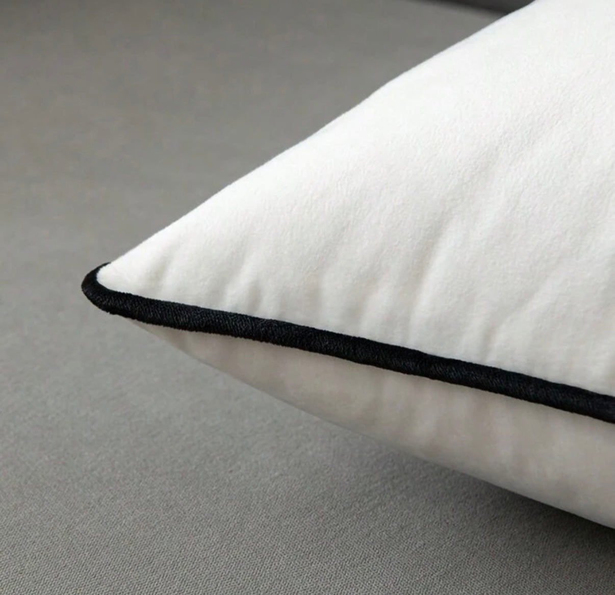 Side angle of Noir Edge cushion showing contrast piping detail| interiors by zai