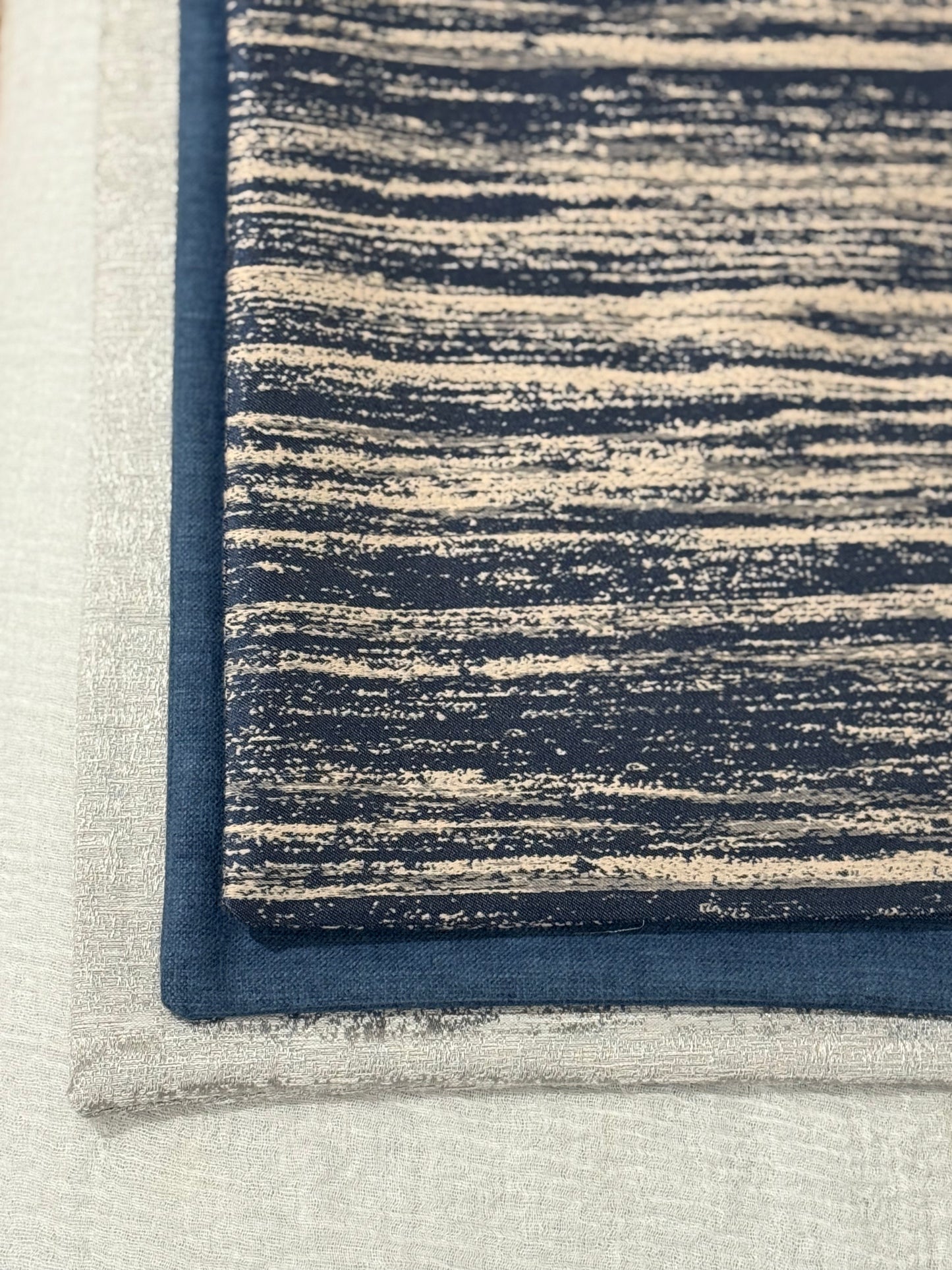 Close up of Midnight Sand Cushion showing navy and beige painterly linear design | Interiors by Zai