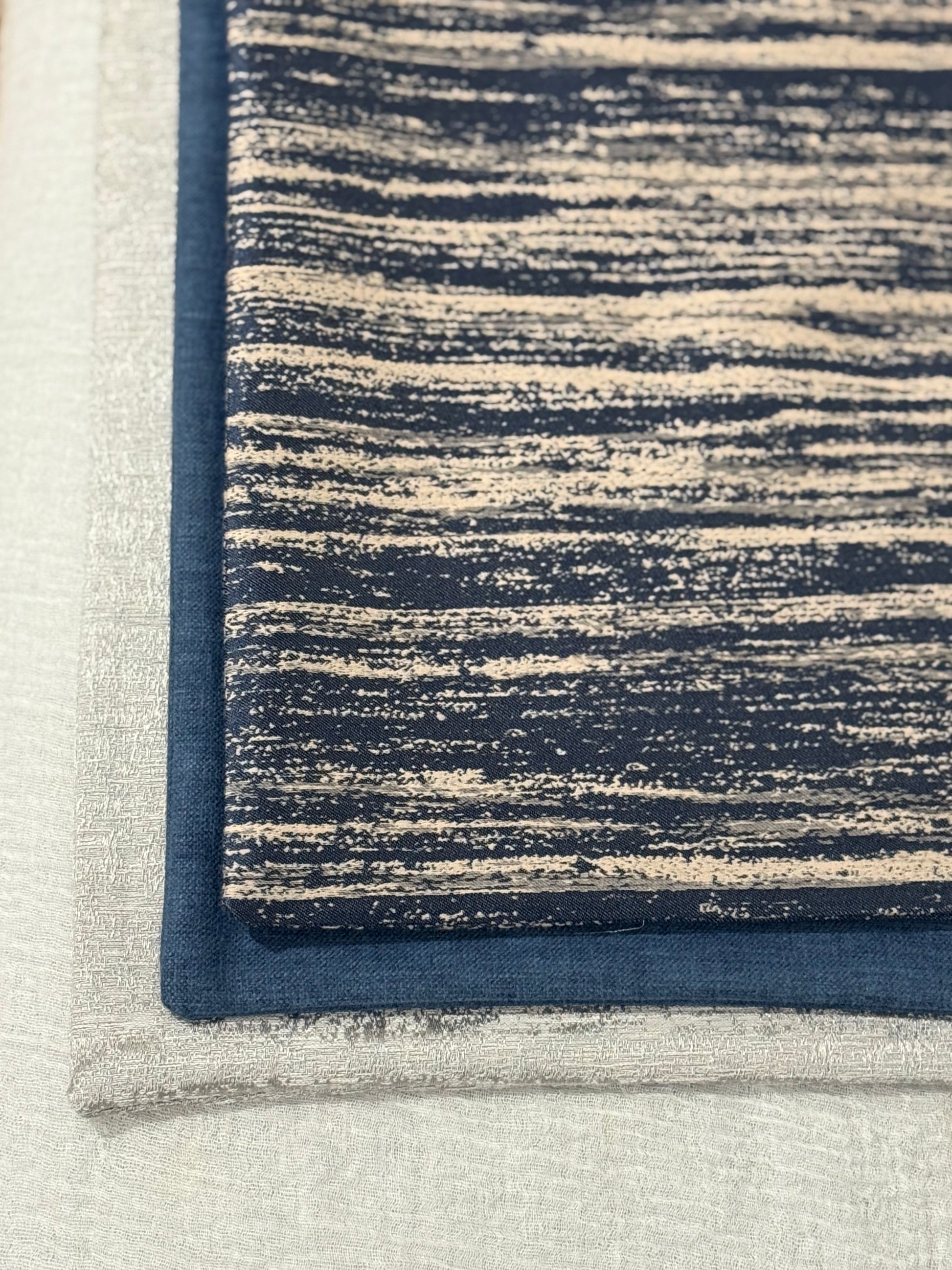 Close up of Midnight Sand Cushion showing navy and beige painterly linear design | Interiors by Zai