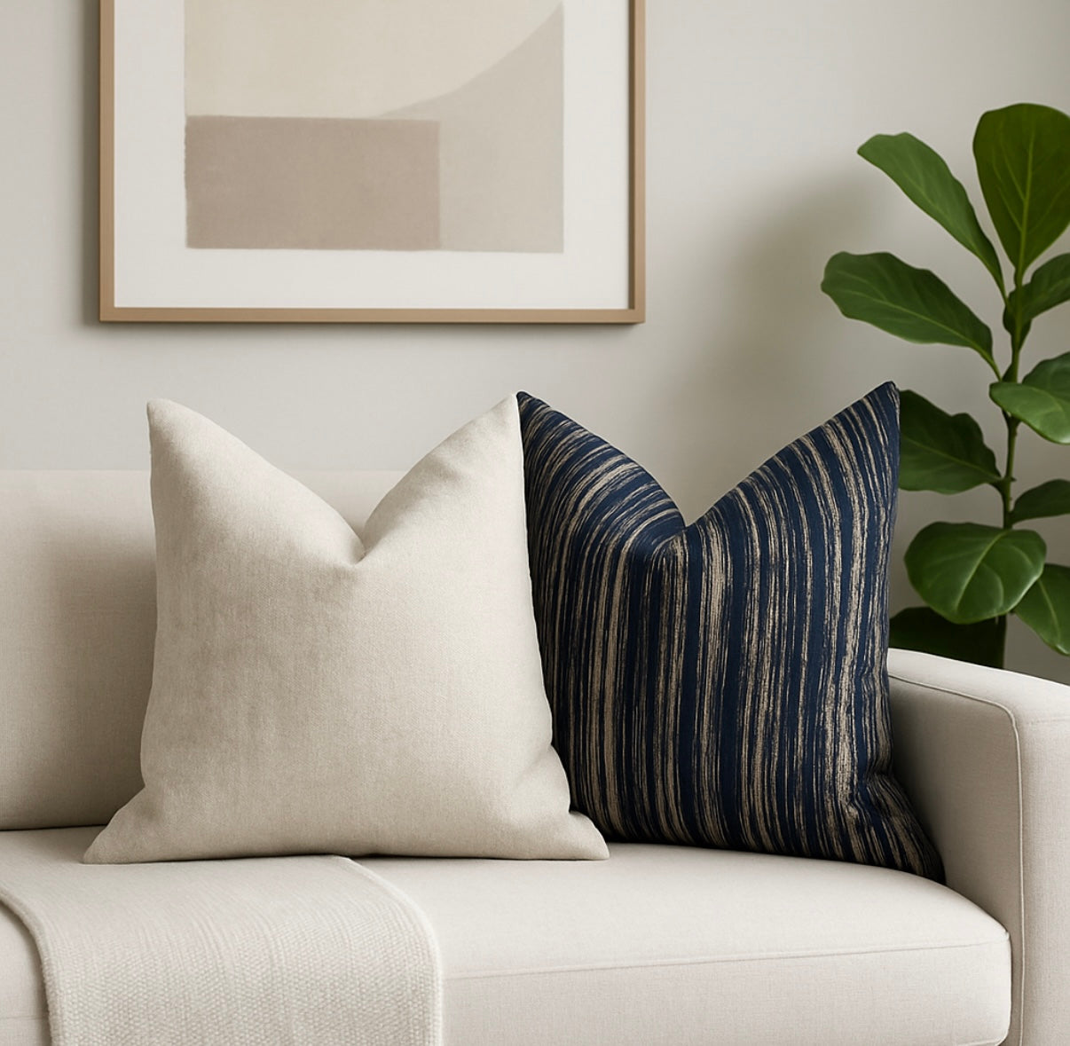 Midnight Sand Cushion styled on armchair with Champagne cushion, adding bold contrast | interiors by zai
