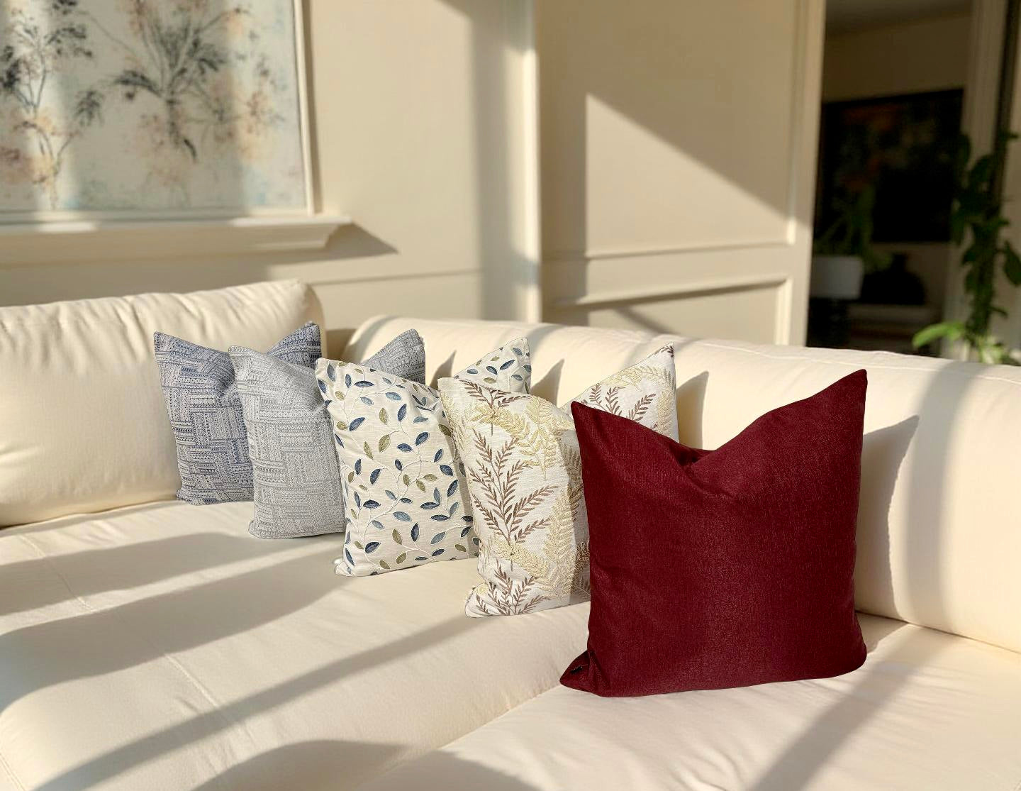 Ruby Luxe Cushion paired with other patterned cushion for a dramatic yet balanced interior look