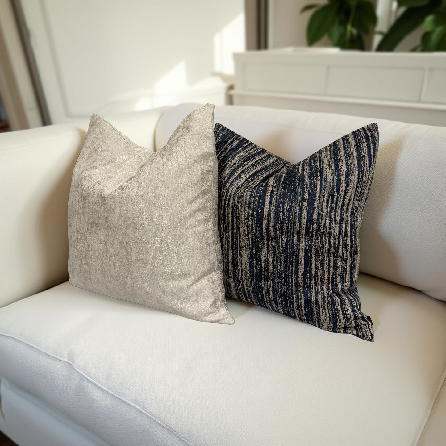 Champagne cushion styled on sofa with Midnight Sand Cushion, adding bold and rich contrast | interiors by zai