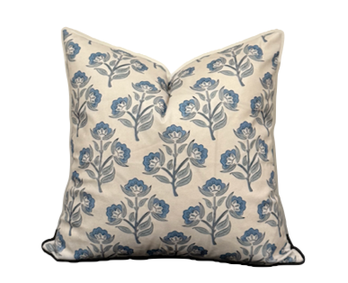 Bluebells cushion with blue and green floral design on white base.
