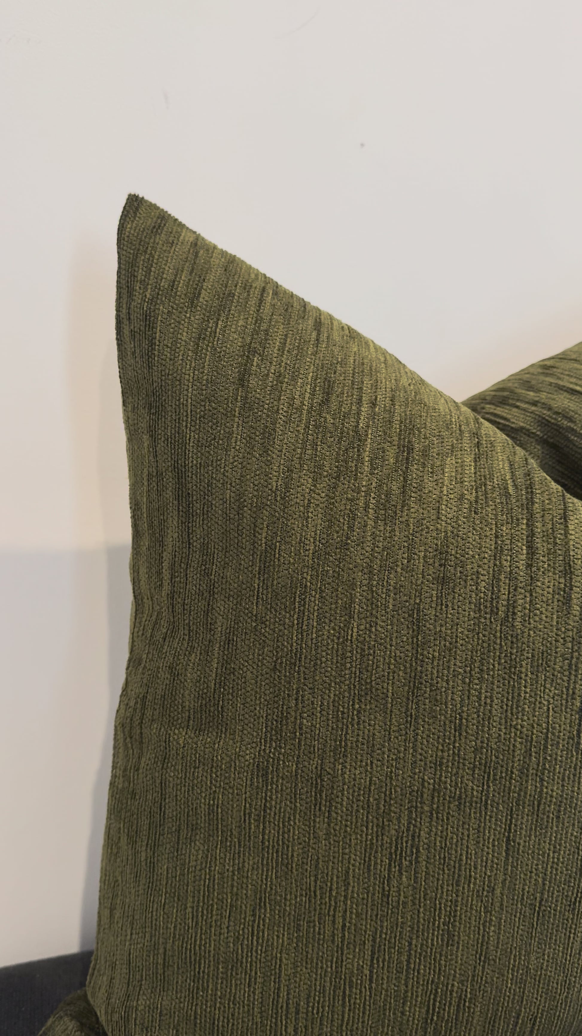 Close up olive green cushion fabric texture detail