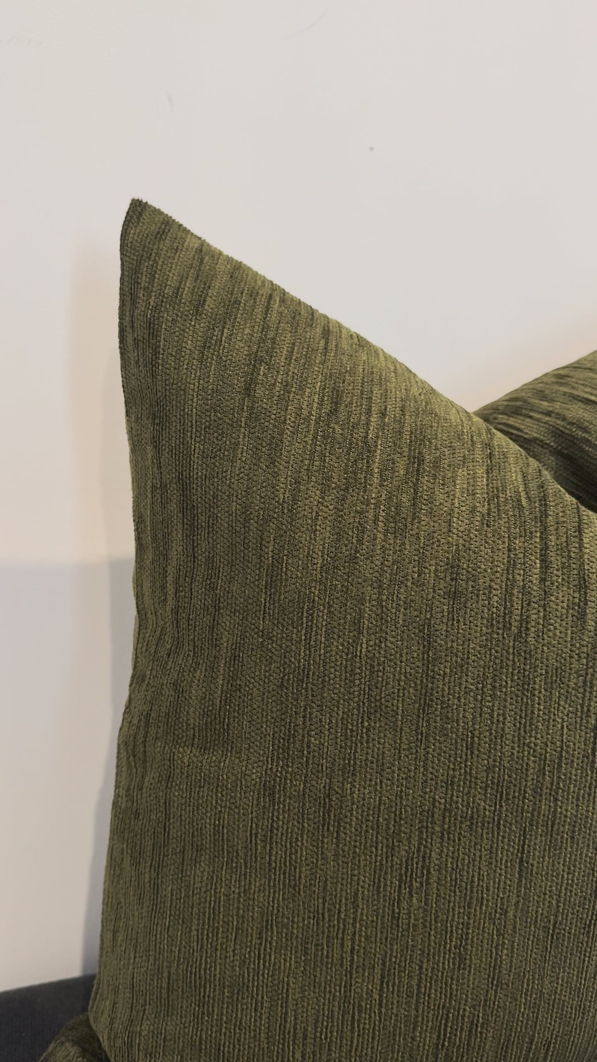 Close up olive green cushion fabric texture detail