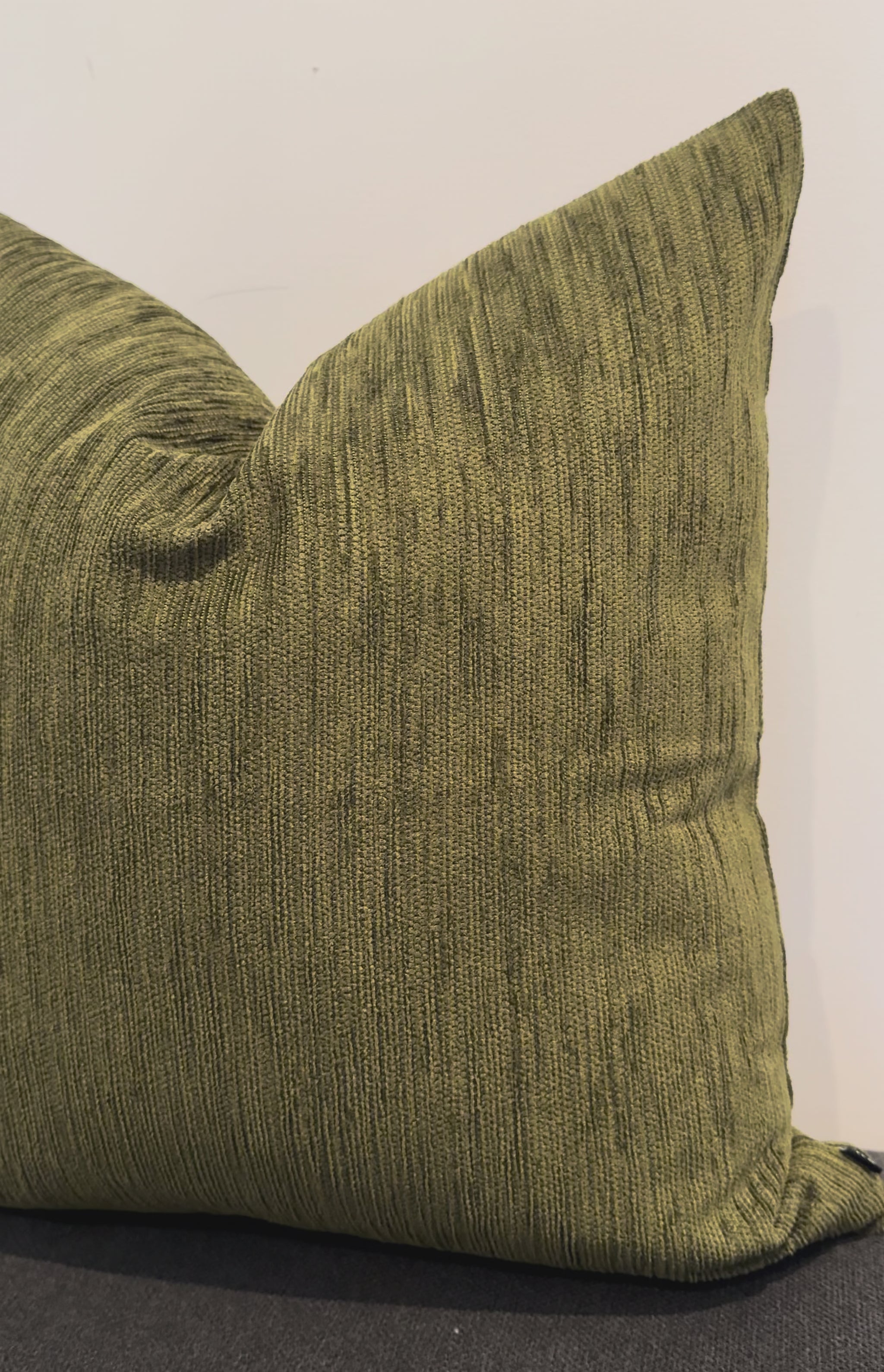 Close up olive green cushion fabric texture detail