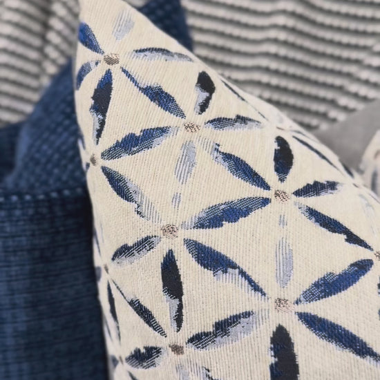 Video close up of cushion showing textured geometric detail.